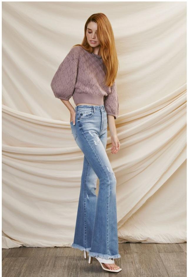 mid-rise, distressed girlfriend fit jeans with button fly.